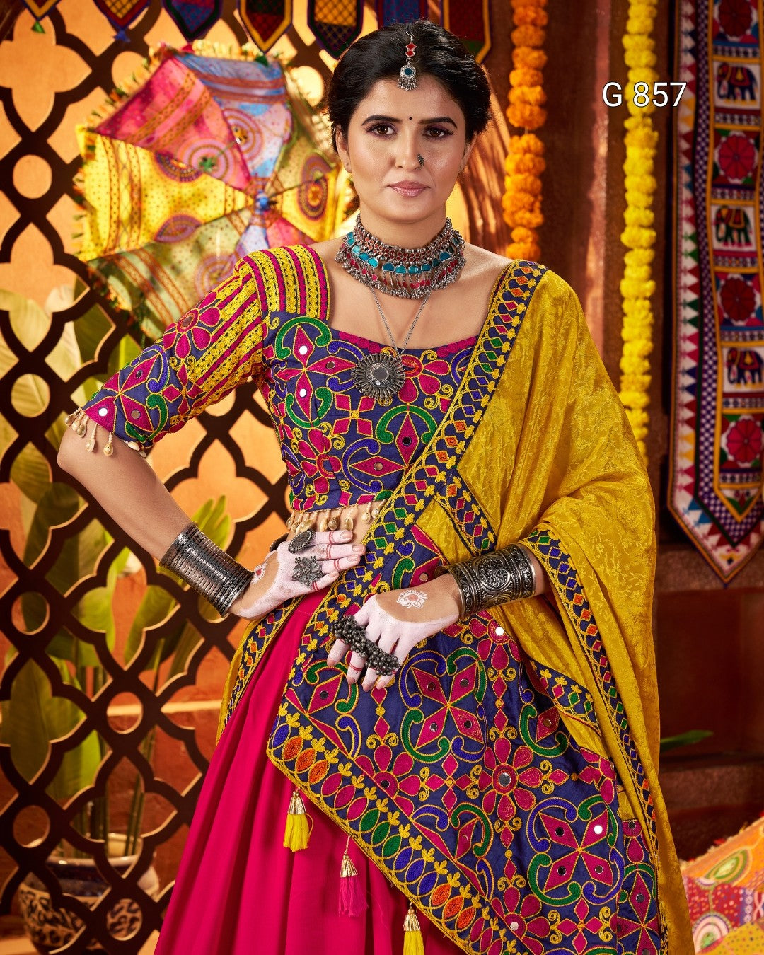 Woman in a colorful traditional outfit with a vibrant background
