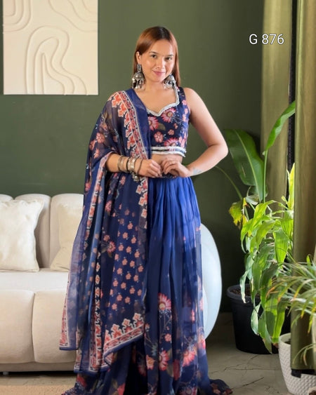 Woman wearing a blue floral dress in a living room setting