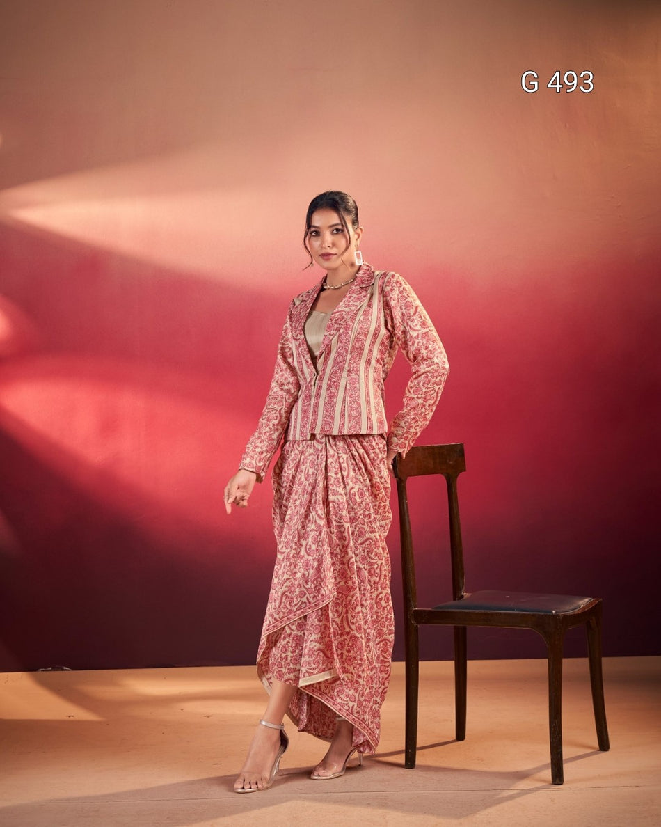 Woman in a pink patterned outfit standing next to a chair against a red background