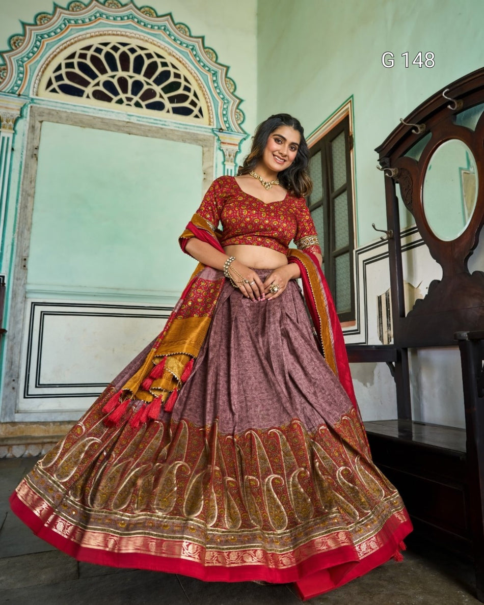 Woman wearing a traditional red and gold lehenga in an indoor setting