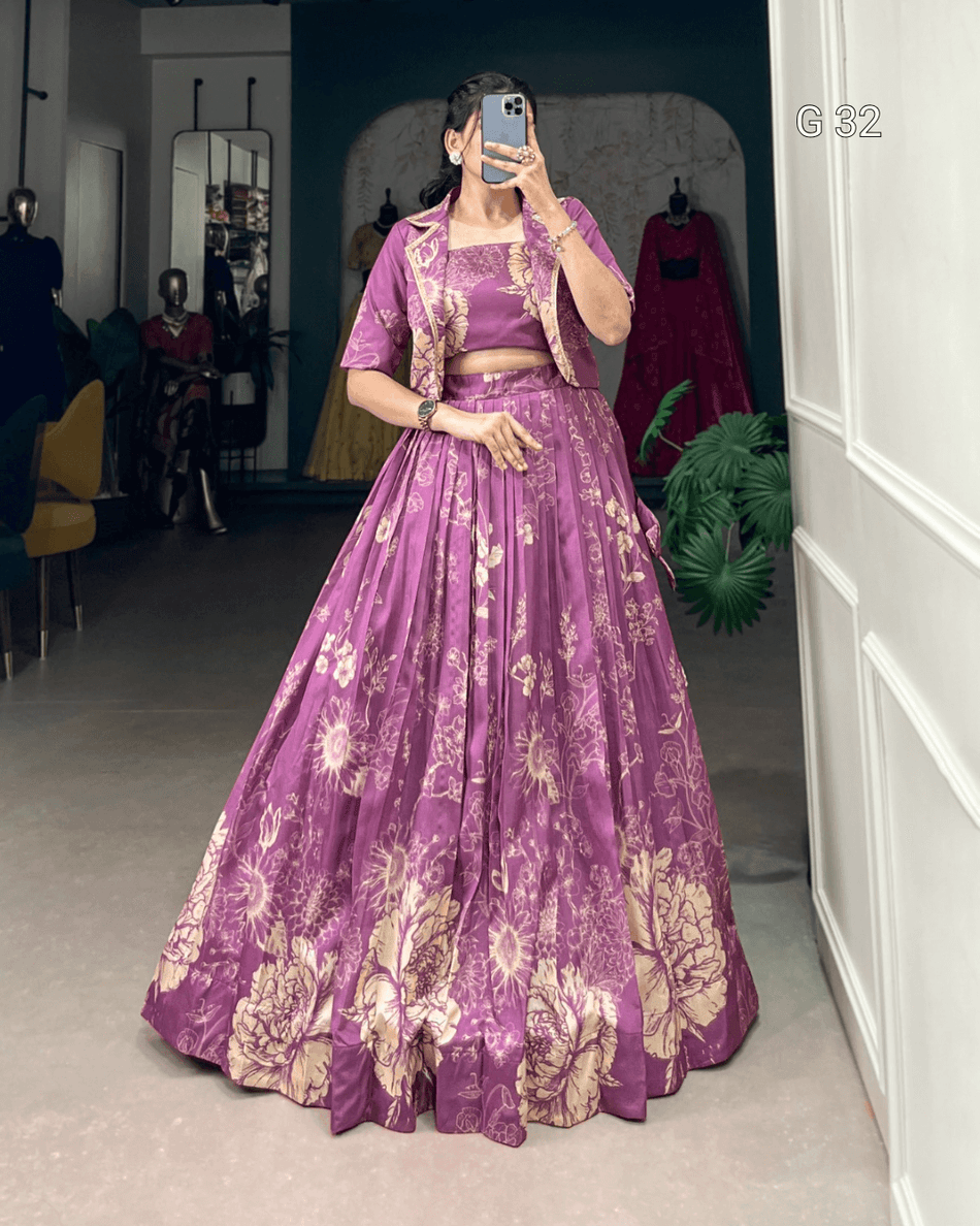 Person wearing a purple floral outfit in a room with a mirror and plant.