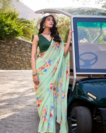 Woman in a floral saree standing next to a golf cart with a scenic background