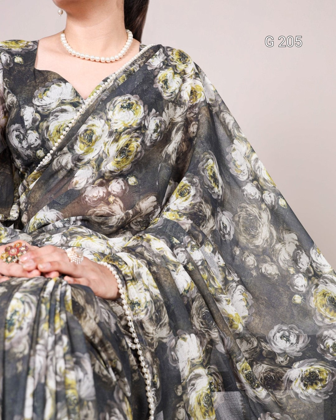 Floral patterned saree with a plain background
