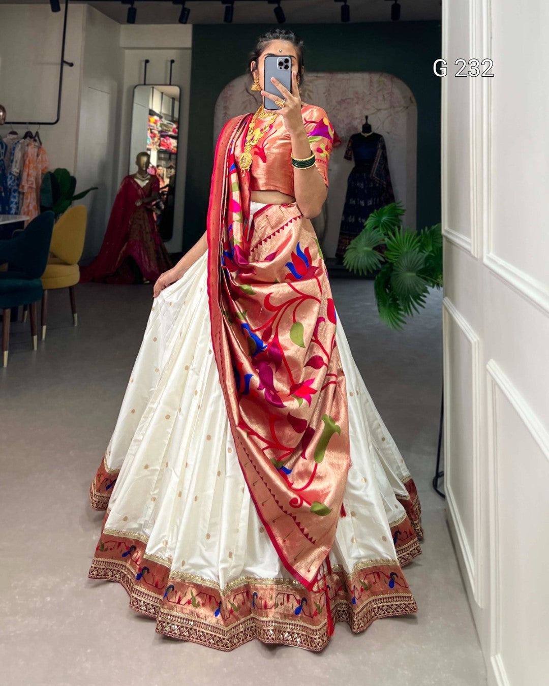 Woman wearing a traditional saree in a store setting