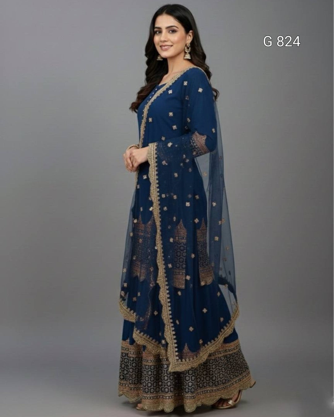 Woman wearing a blue embroidered traditional outfit on a gray background