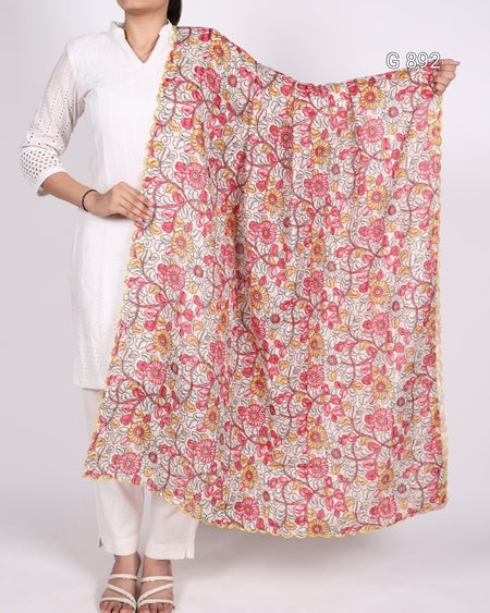 Person holding a floral patterned scarf against a white background