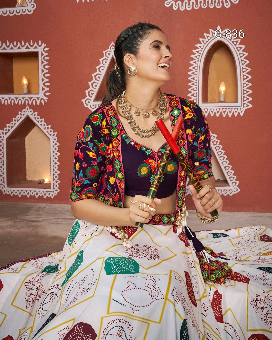 Woman in traditional attire with a colorful background