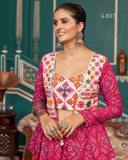 Woman wearing a traditional outfit with intricate patterns in a decorative setting