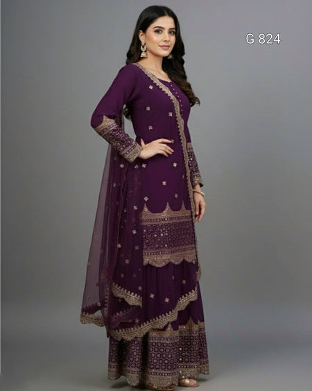 Woman wearing a purple traditional outfit with gold patterns on a gray background