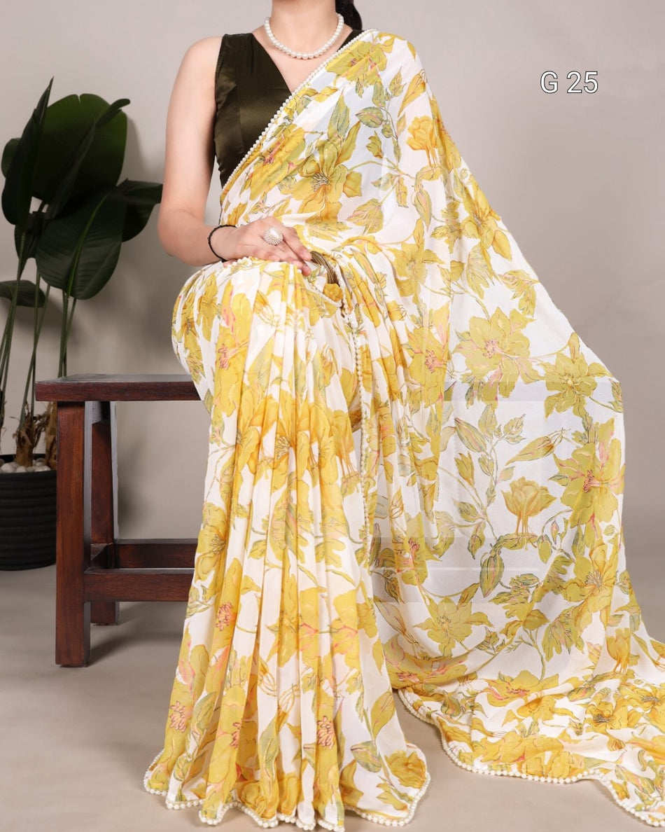 Woman wearing a yellow and white floral saree with a plant in the background