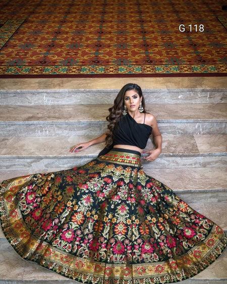 Woman wearing a traditional embroidered skirt with a wooden floor background