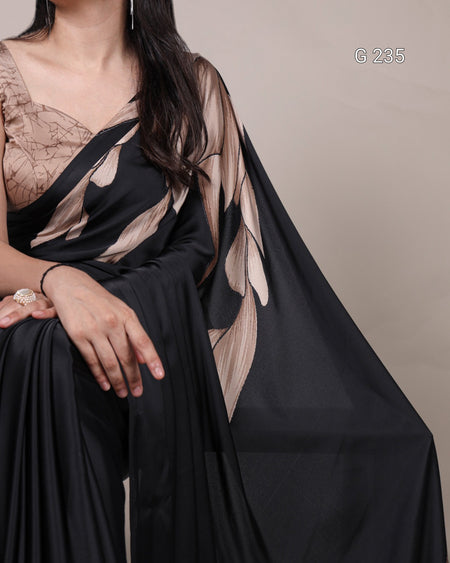 Black sheer fabric draped over a person with a neutral background