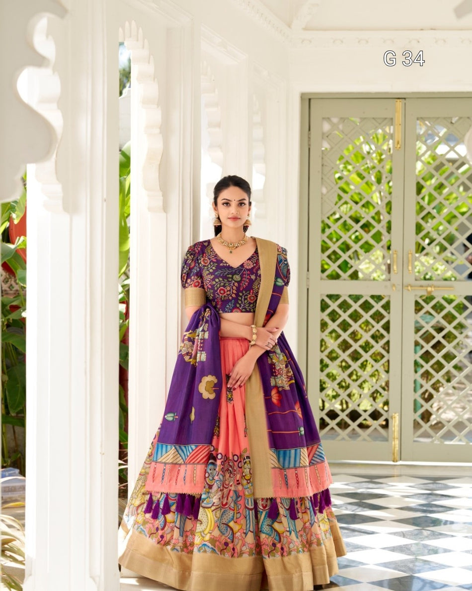 Woman in a colorful traditional outfit standing in a decorative indoor setting.