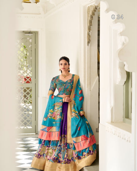 Woman in a colorful traditional outfit standing in a bright room.