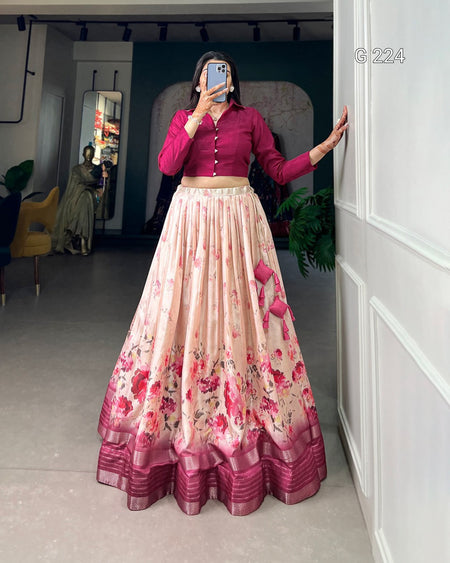 Person wearing a pink floral dress taking a mirror selfie in a room.