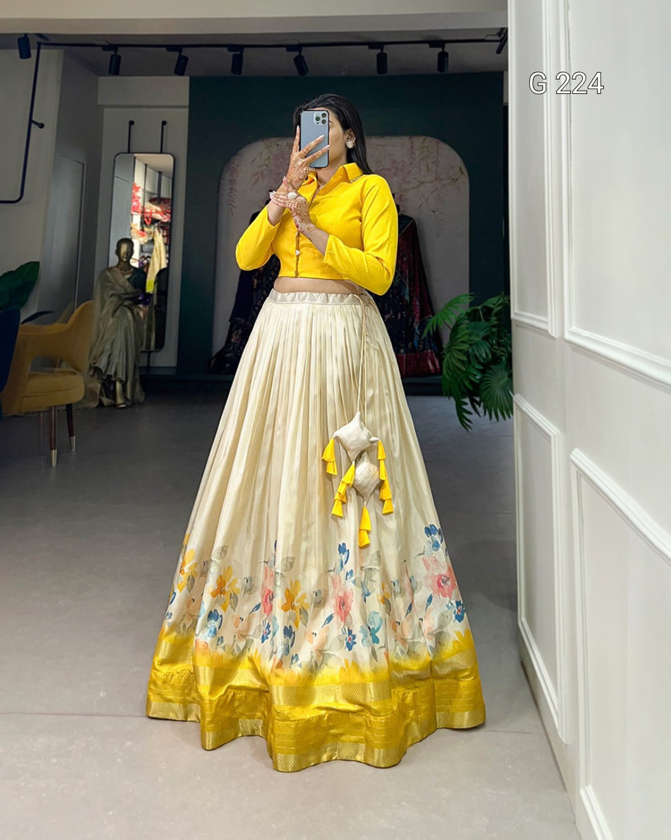 Person wearing a yellow top and floral skirt in a room with a mirror.